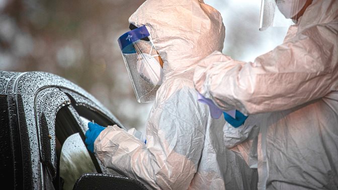 Medical staff collect samples at a COVID-19 Community-Based Testing Site