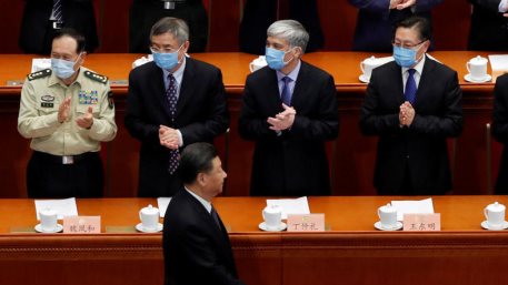 Delegates applaud as Chinese President Xi Jinping arrives for the opening session of China's National People's Congress (NPC).