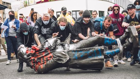 Protesters transport the statue of slave trader Edward Colston towards the river Avon in Bristol, U.K.