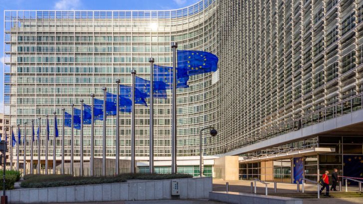 Row of EU Flags in front of the European Union Commission building in Brussels.