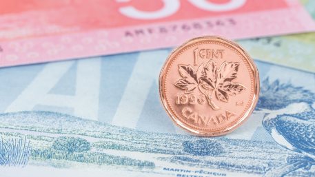 Canadian coin dollar stand on Canada banknote money