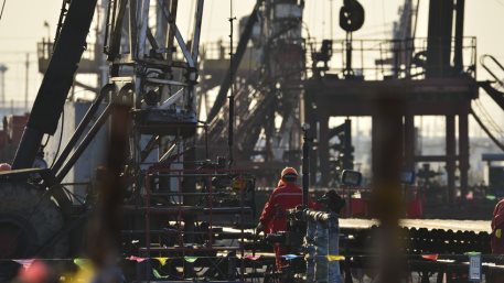 Field oil workers at work