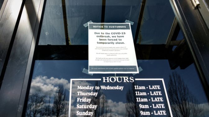 Closed sign on entrance to pub during time of Coronavirus Covid-19 pandemic