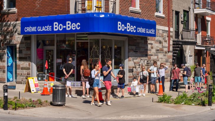 Montreal, CA - 23 May 2020: People in line to buy ice-cream during Coronavirus pandemic on Laurier street