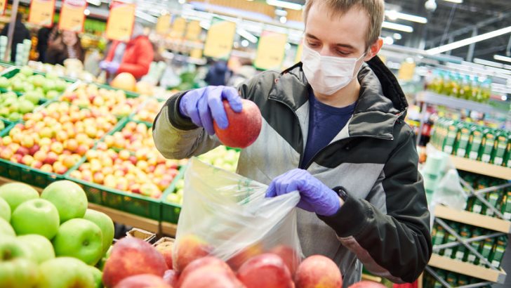 Man in Protective Gear Shopping During the Coronavirus Pandemic