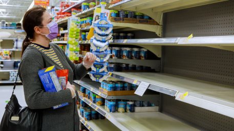 Woman wearing face mask buying in supermarket shopping during Coronavirus covid-19 pandemic