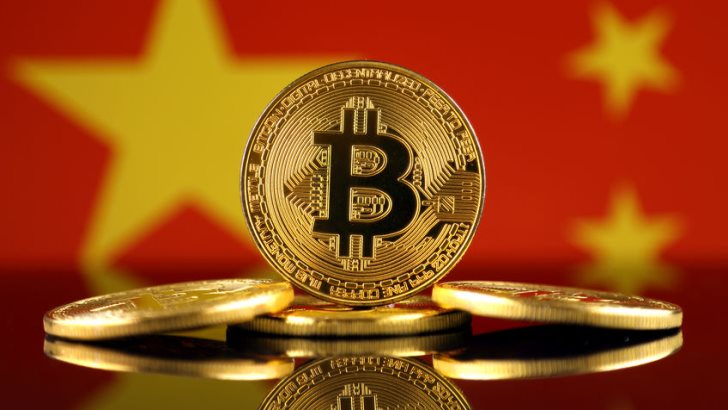 Physical version of Bitcoin (new virtual money) and China Flag. Conceptual image for investors in cryptocurrency and Blockchain Technology in China.