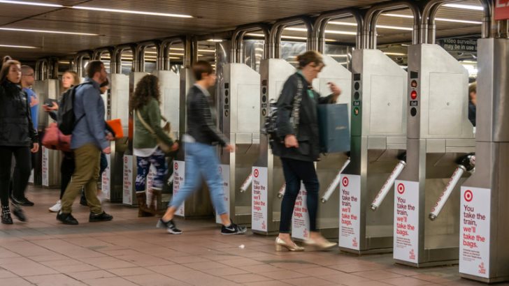 Commuters going through the turnstiles in a subway station in New York City